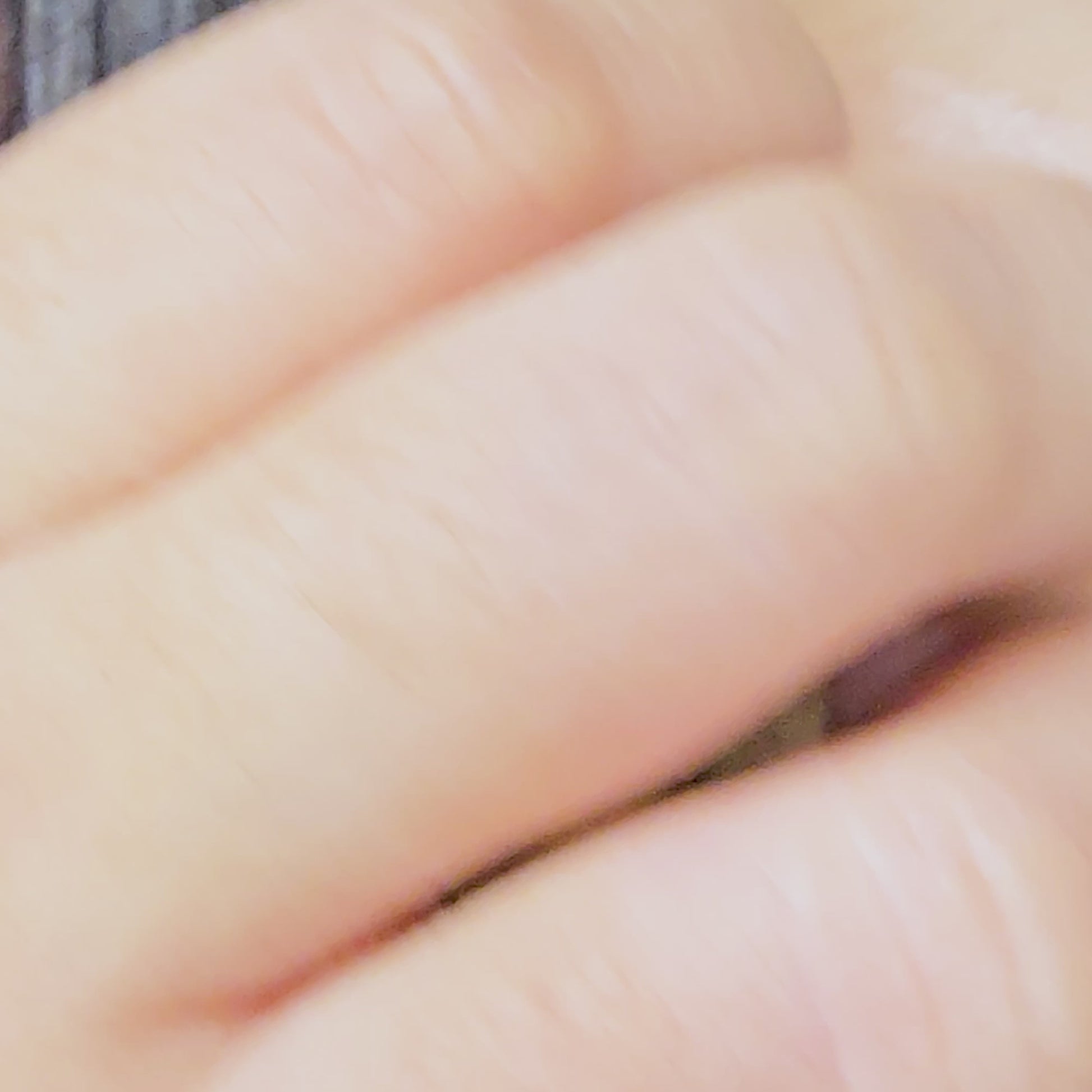 Video demonstration showing the light-reflecting hammered finish and secure fit of the gold V sculptural earrings on a model.