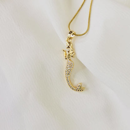 Video showing the sparkle and detail of the pavé crystal mermaid pendant and gold snake chain.
