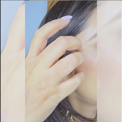 Video demonstration showing the twisting movement and brilliant shimmer of the dual-tone layered statement earrings.