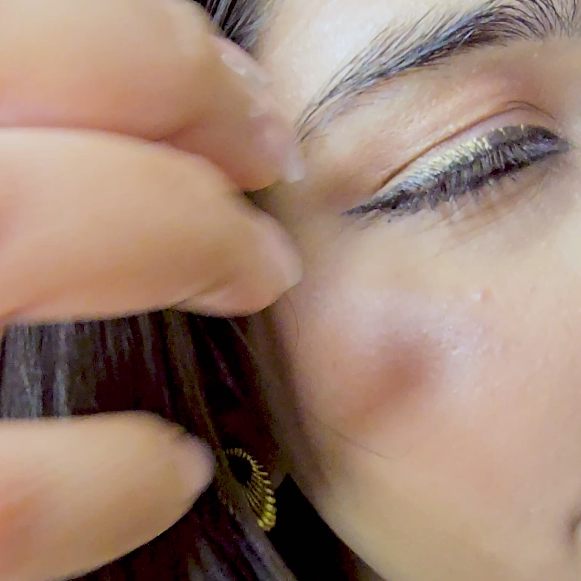 Close-up video of a model wearing the high-shine gold shell earrings, demonstrating the light-reflecting ribbed texture and secure fit.