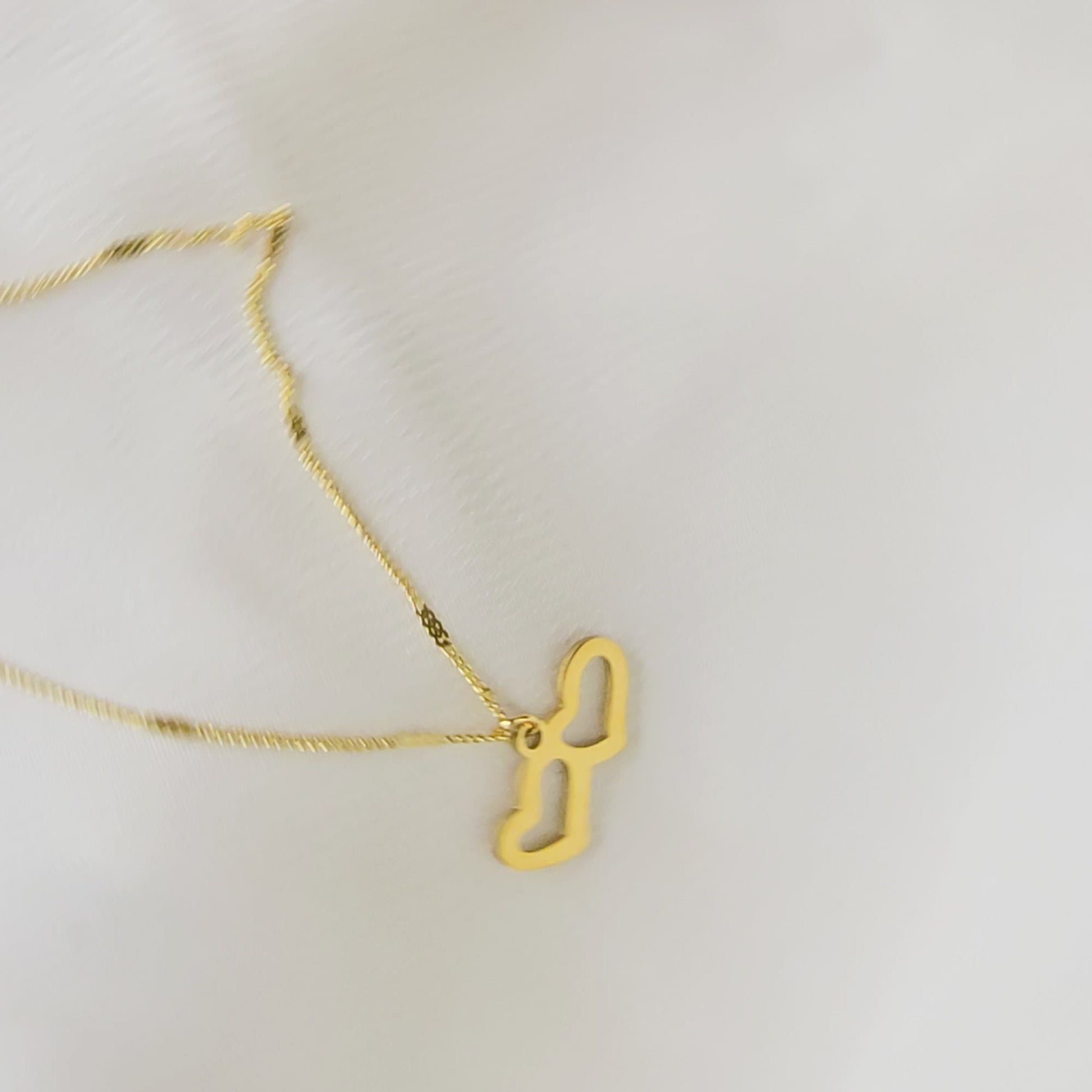 360-degree video of Twin Heart Necklace showing pendant details and chain shine.