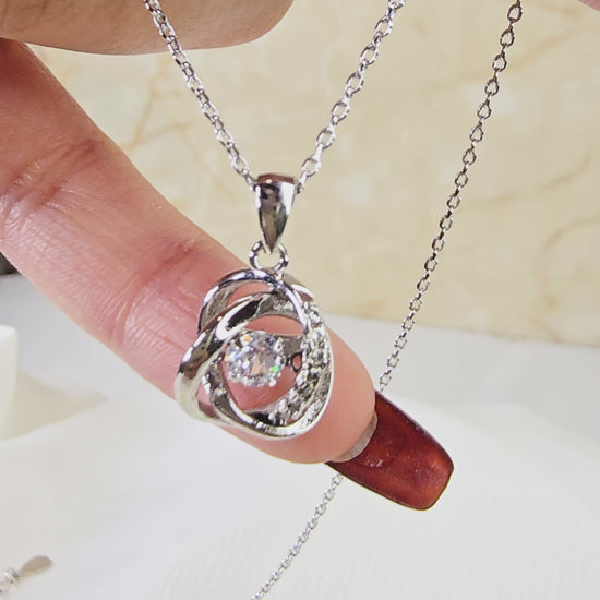 Video demonstrating the constant motion and dazzling light reflection of the dancing stone pendant.